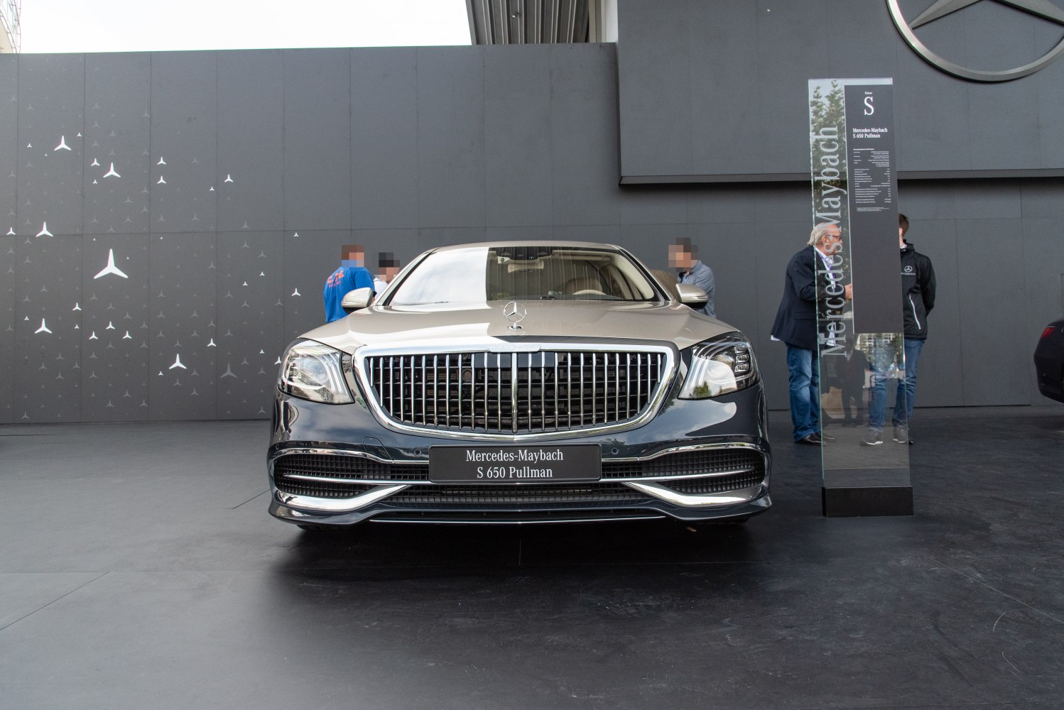 Front view with prominent chrome grille and LED headlights