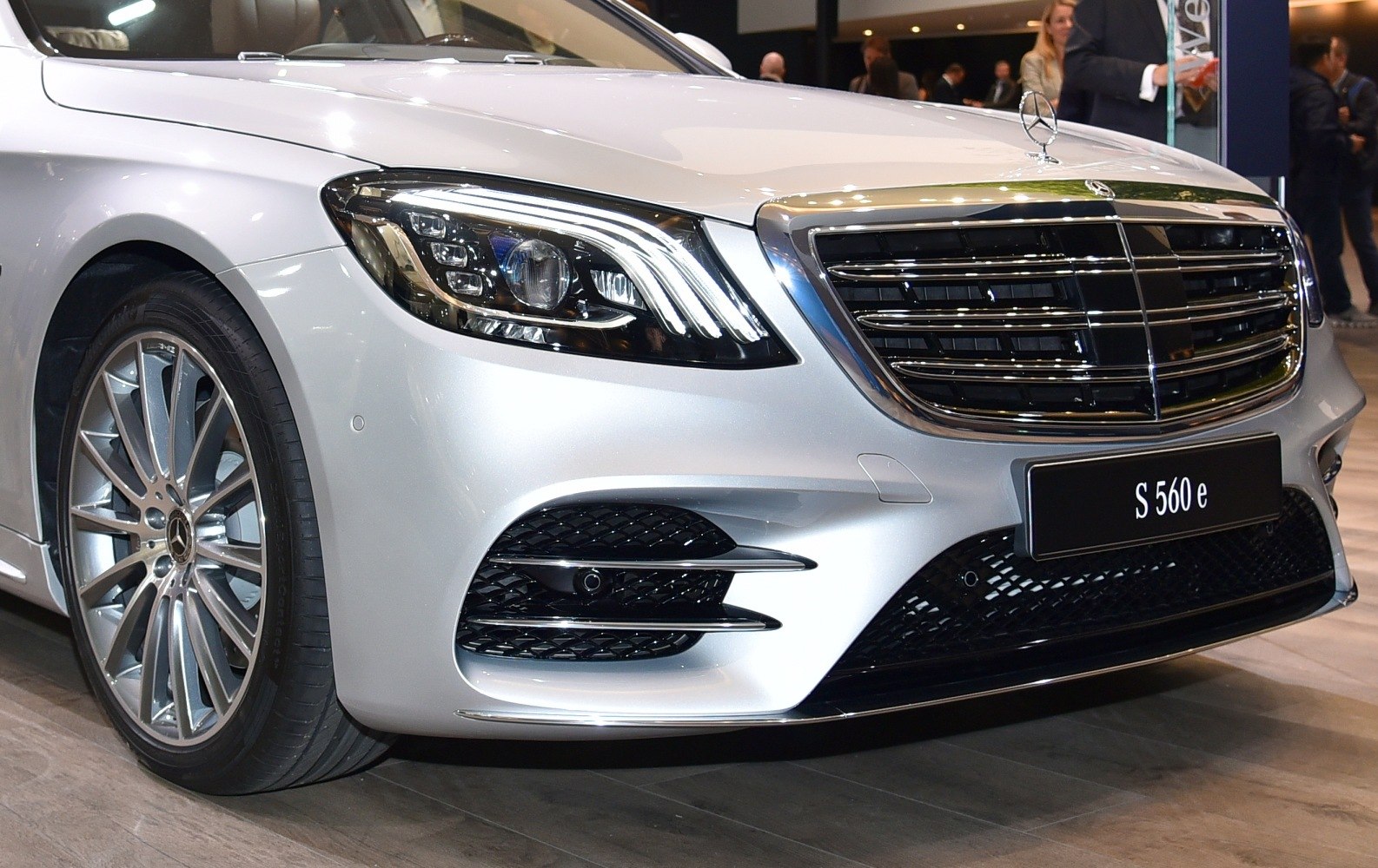 Front close-up featuring headlights, grille, and sporty bumper.