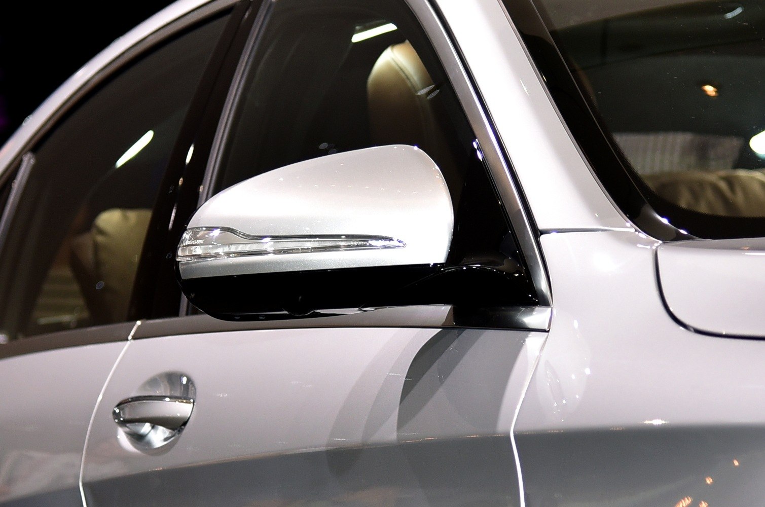 Close-up of side mirror with integrated turn signal
