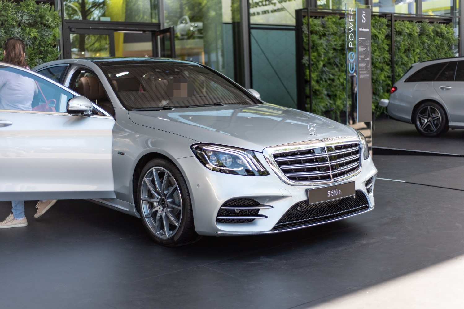 Luxury sedan front with LED headlights and chrome grille