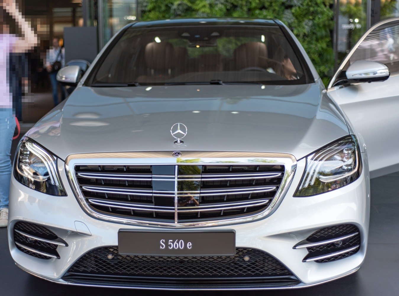 Luxury sedan front grille with LED headlights and chrome detailing