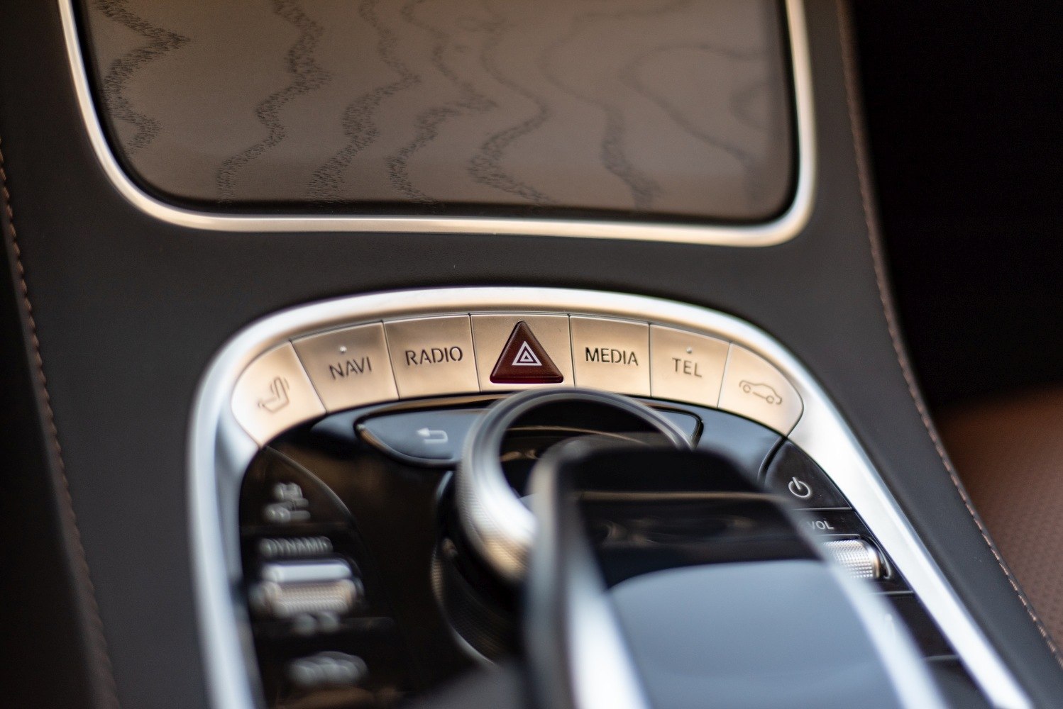 Central control panel with navigation, media, and hazard buttons
