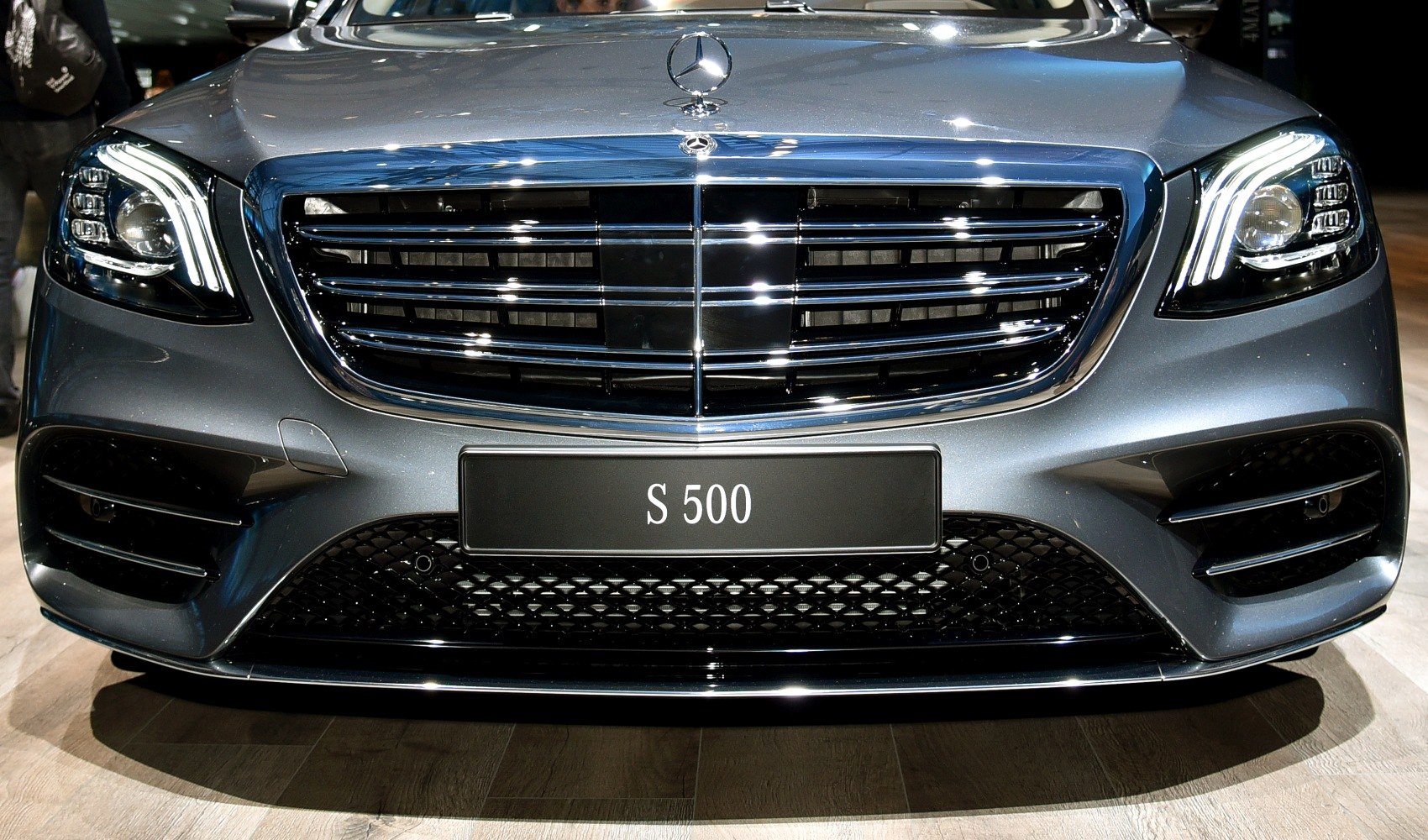 Front grille and LED headlights of luxury sedan.