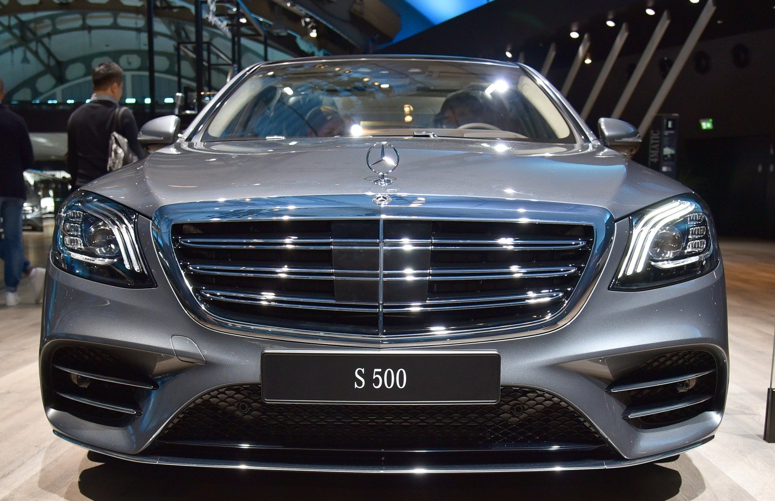 Front grille, emblem, LED headlights of luxury sedan