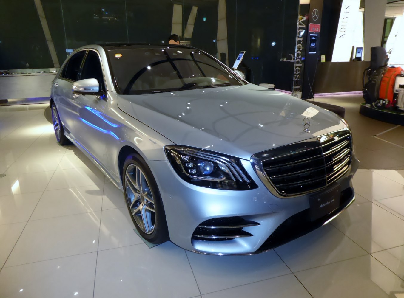 Front view of a luxury sedan with LED headlights and chrome grille