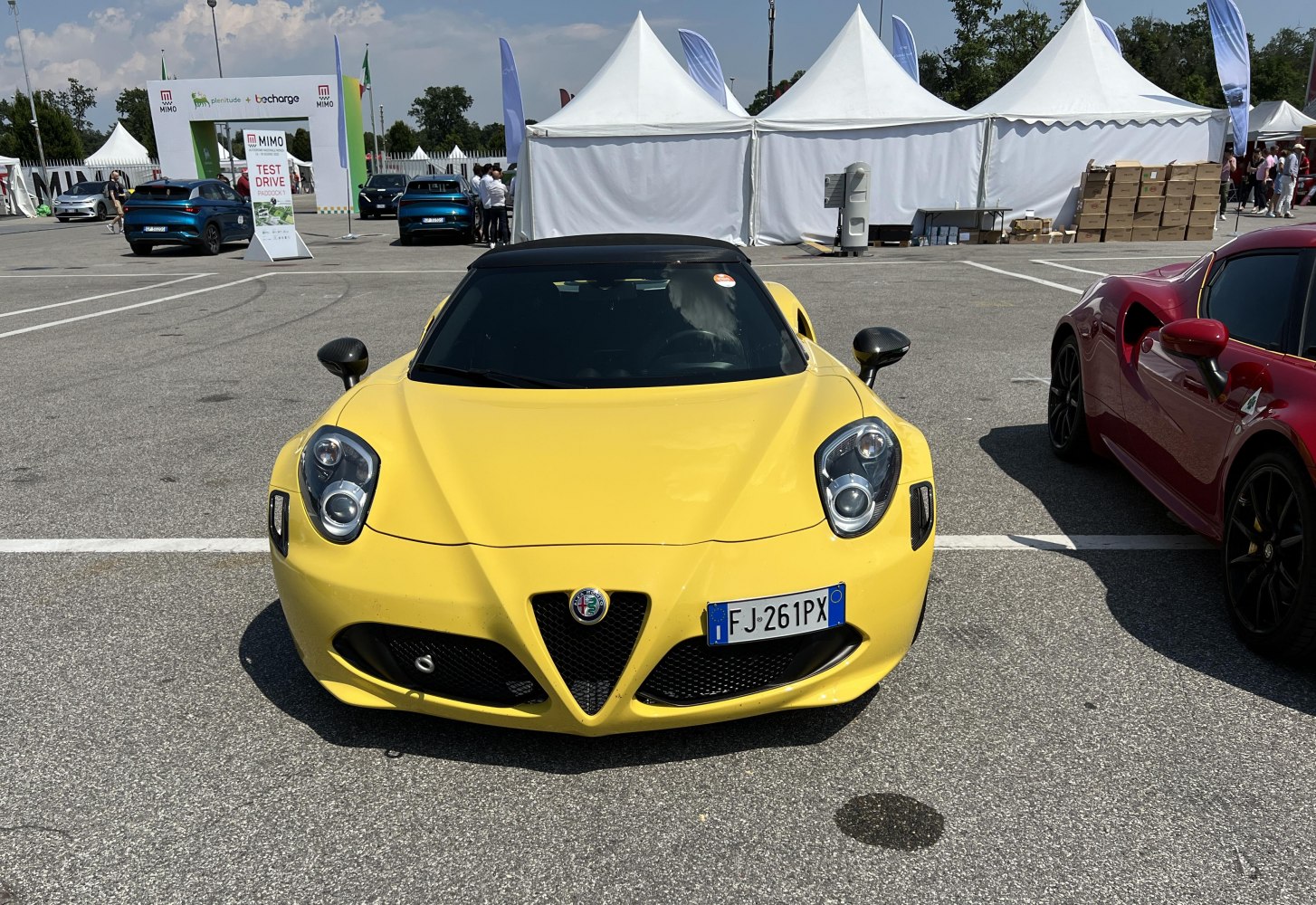 Front view of yellow sporty convertible with sharp headlights