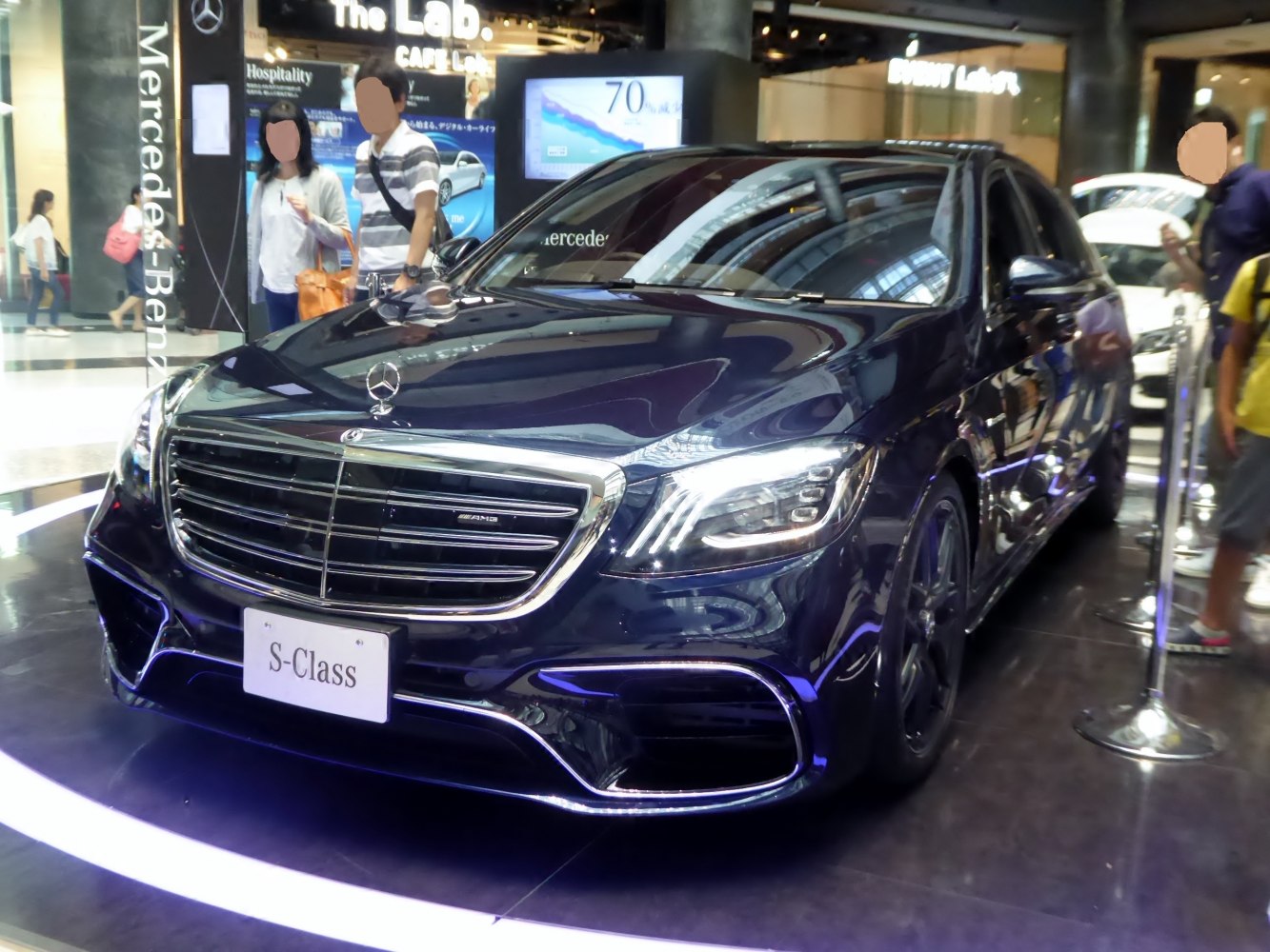 Luxury sedan front with LED headlights and chrome grille