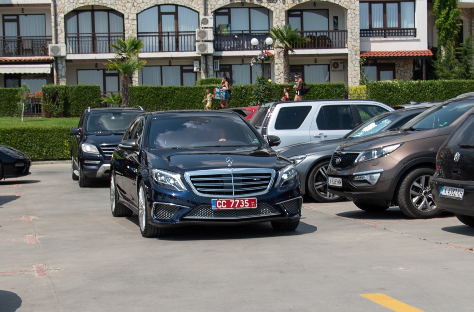 Black luxury sedan front view with chrome grille and LED headlights