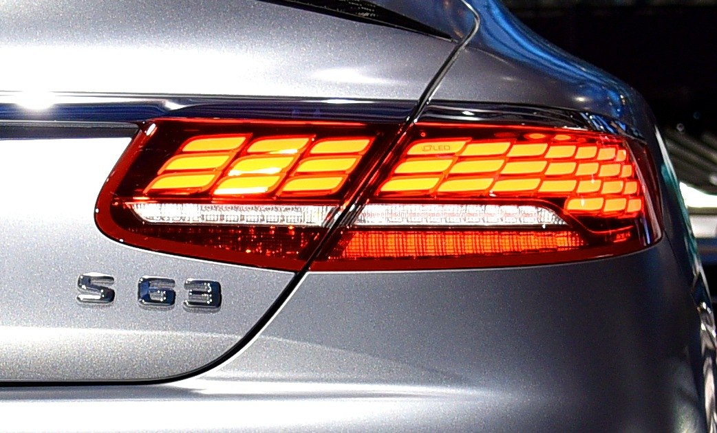 Rear LED tail light and S 63 badge on silver car