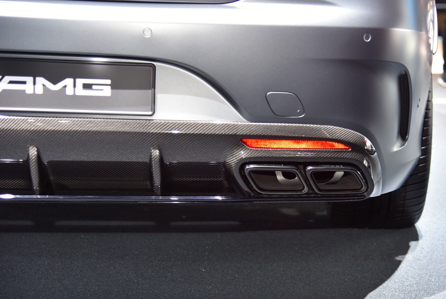 Rear diffuser with carbon fiber and twin rectangular exhaust tips.