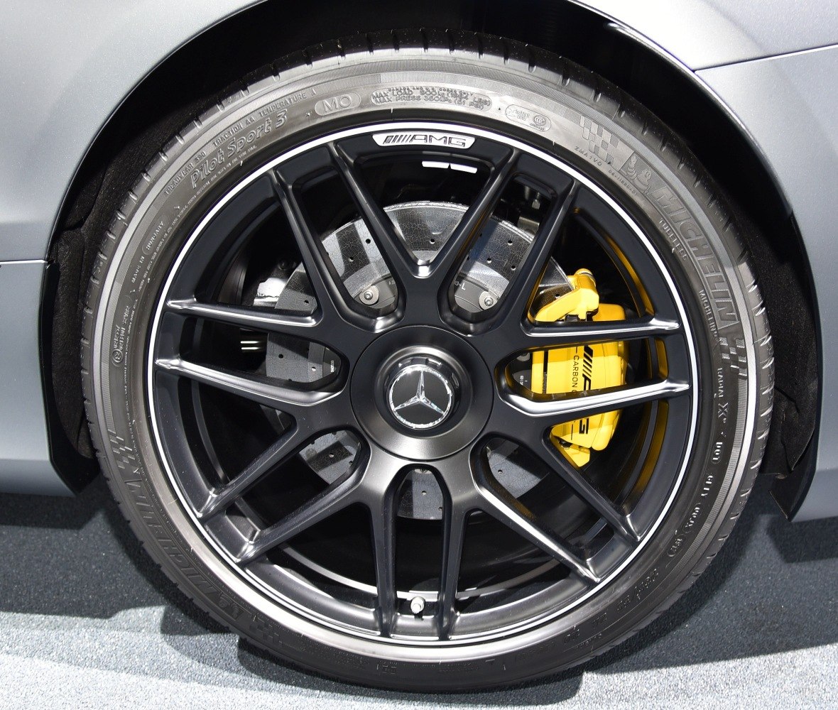 AMG multi-spoke black wheel and yellow performance brake caliper