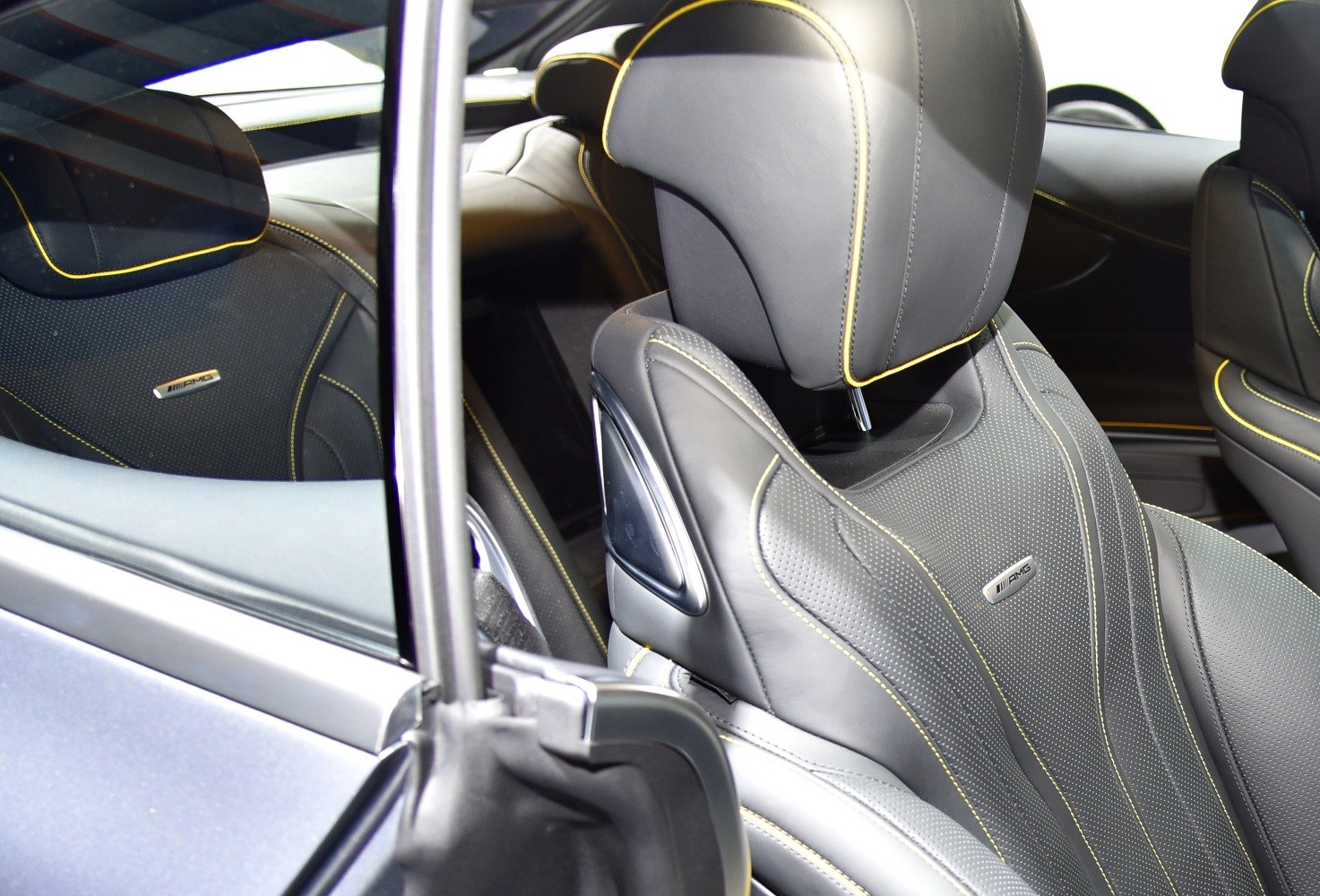 AMG sport leather seat with perforated texture and yellow detailing