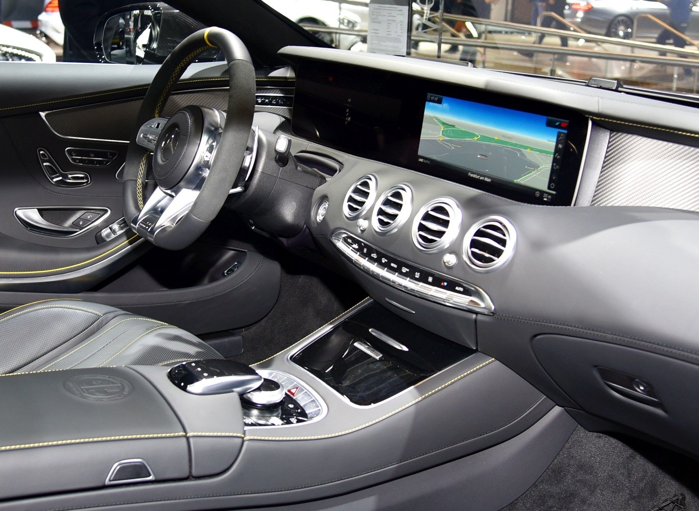 Luxury interior dashboard with digital display and black leather details