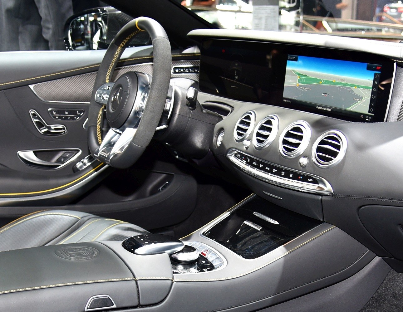 Luxury dashboard with digital cluster and sporty steering wheel