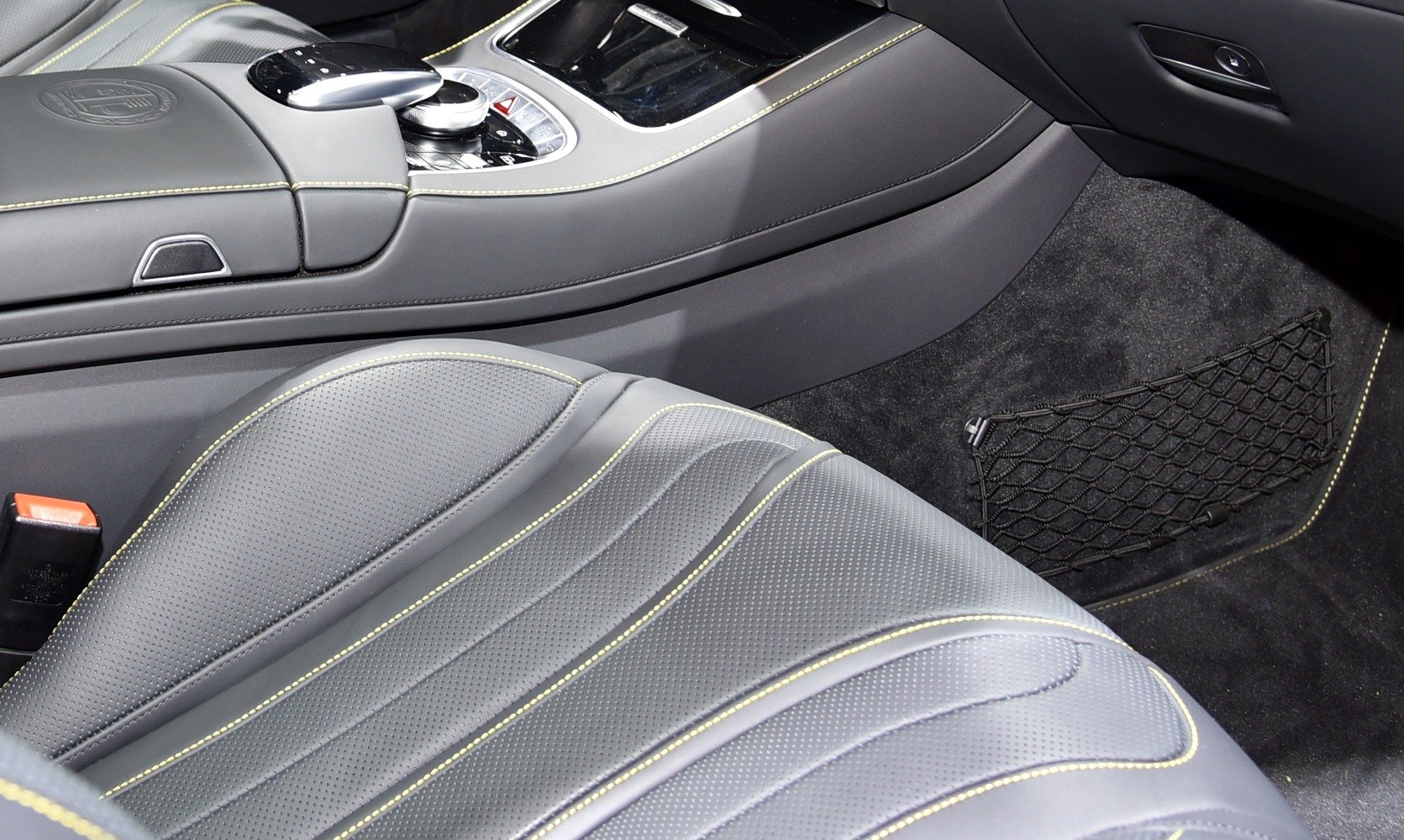 Perforated leather seat with contrast stitching and center console detail