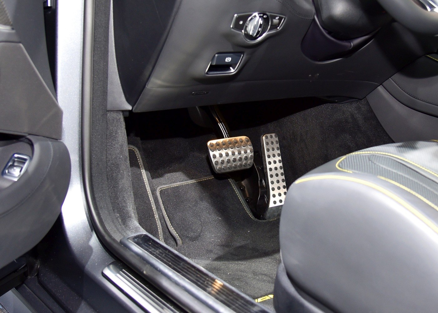 Sporty metal pedals and detailed luxury car footwell
