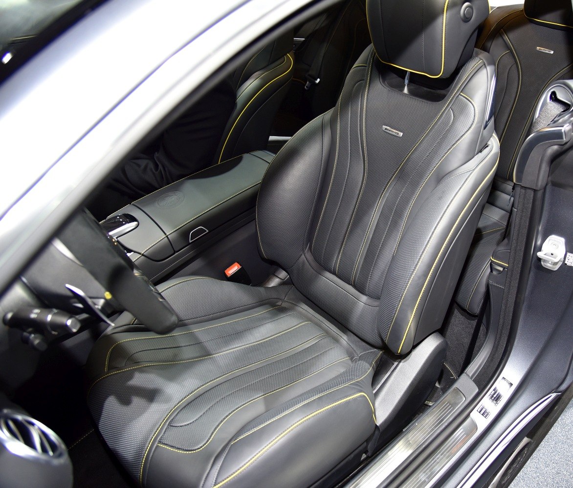 Luxury AMG leather sport seat with yellow stitching and ergonomic design.