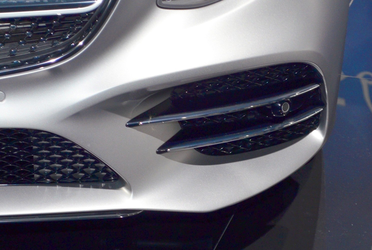 Dual horizontal chrome air intake vents on front bumper