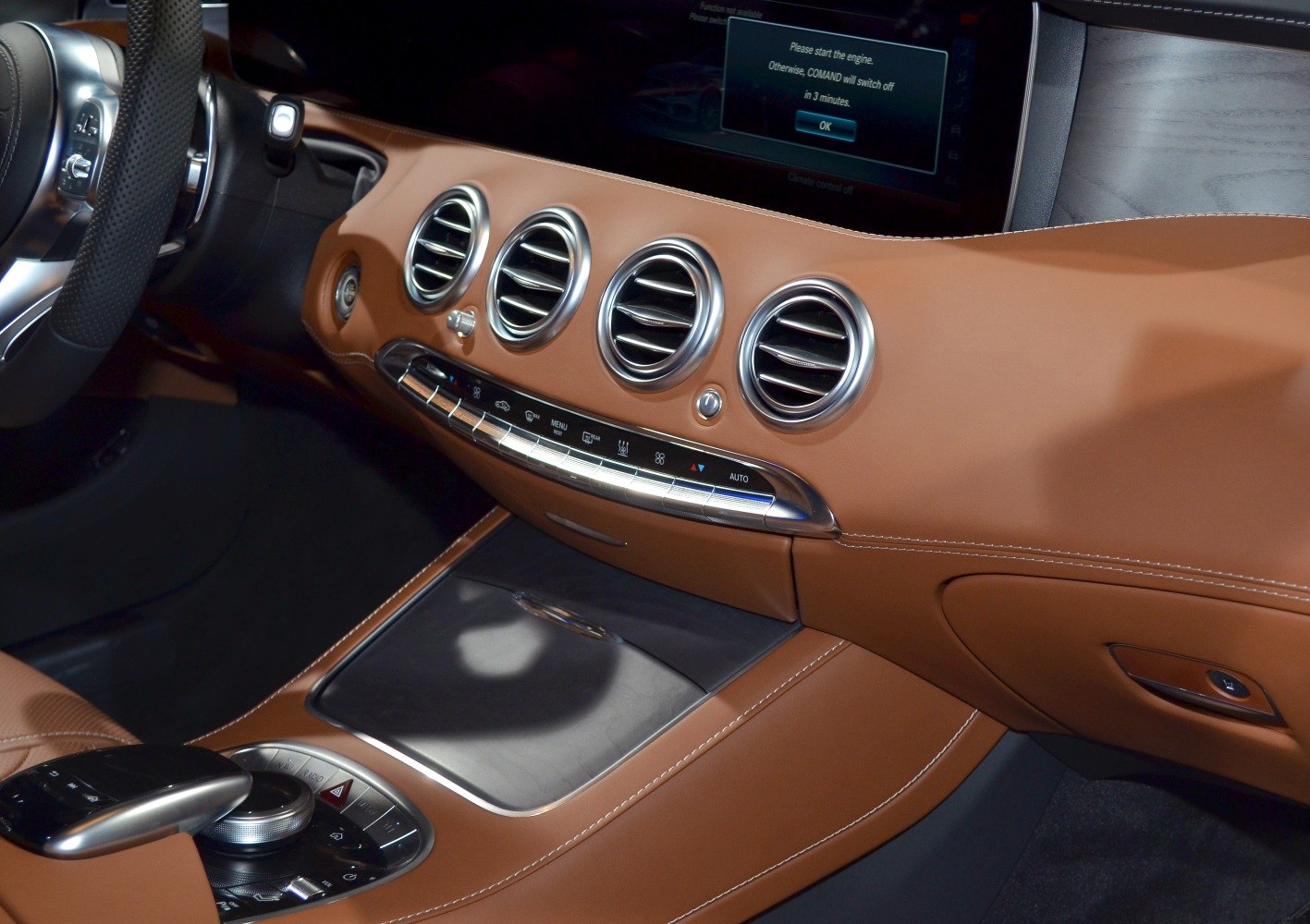 Luxury dashboard with round air vents and advanced control panel