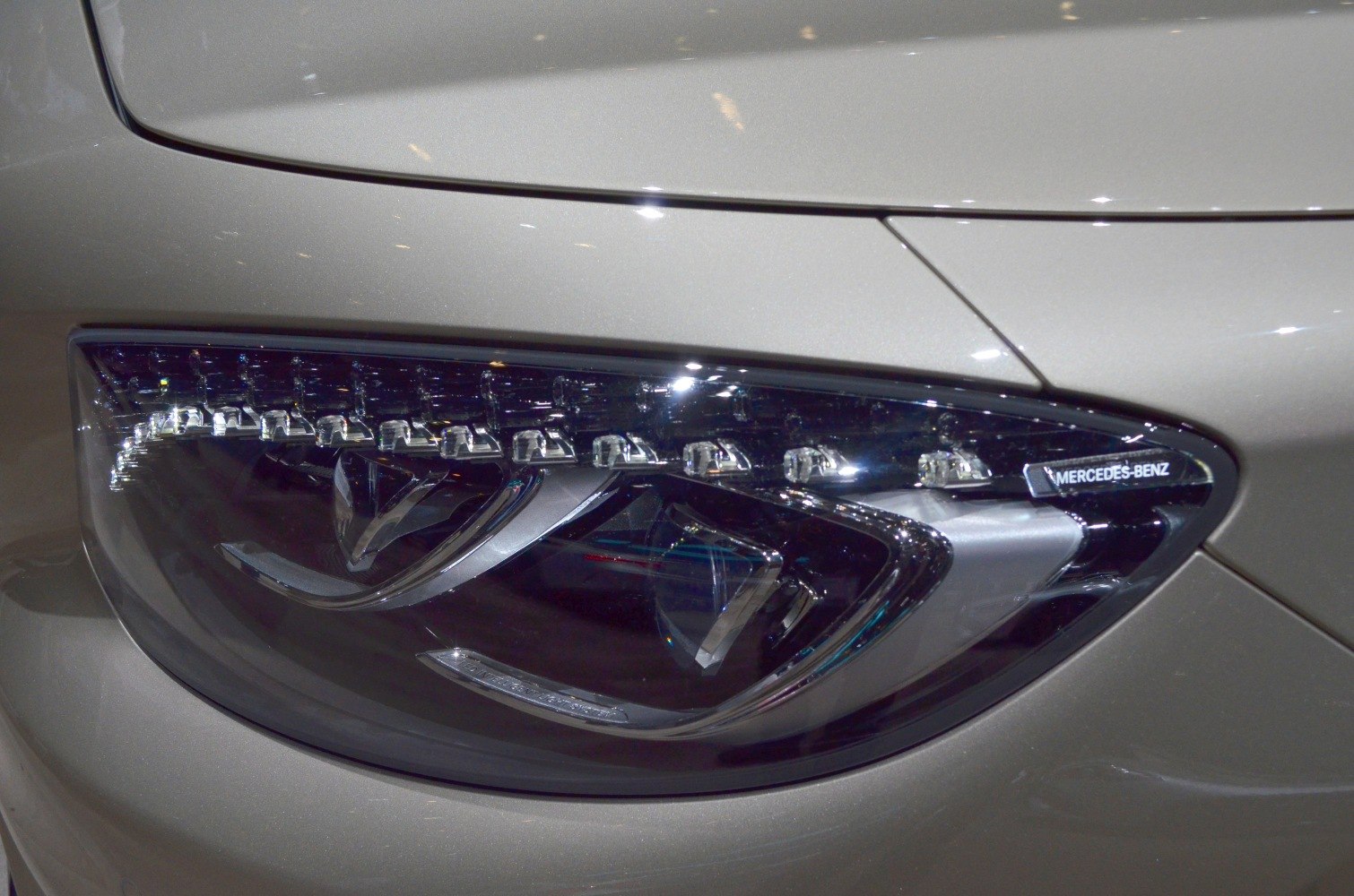 Close-up of sleek LED headlight with intricate lighting elements