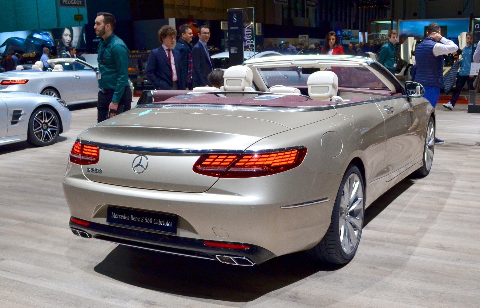 Luxury convertible rear view with LED taillights and quad exhaust