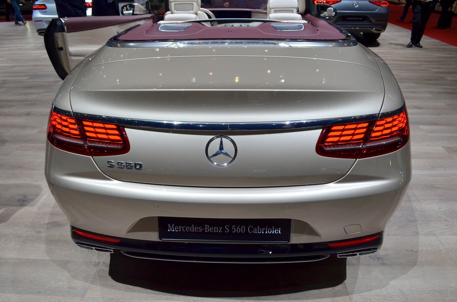 Rear view of luxury convertible with LED tail lights and chrome accents