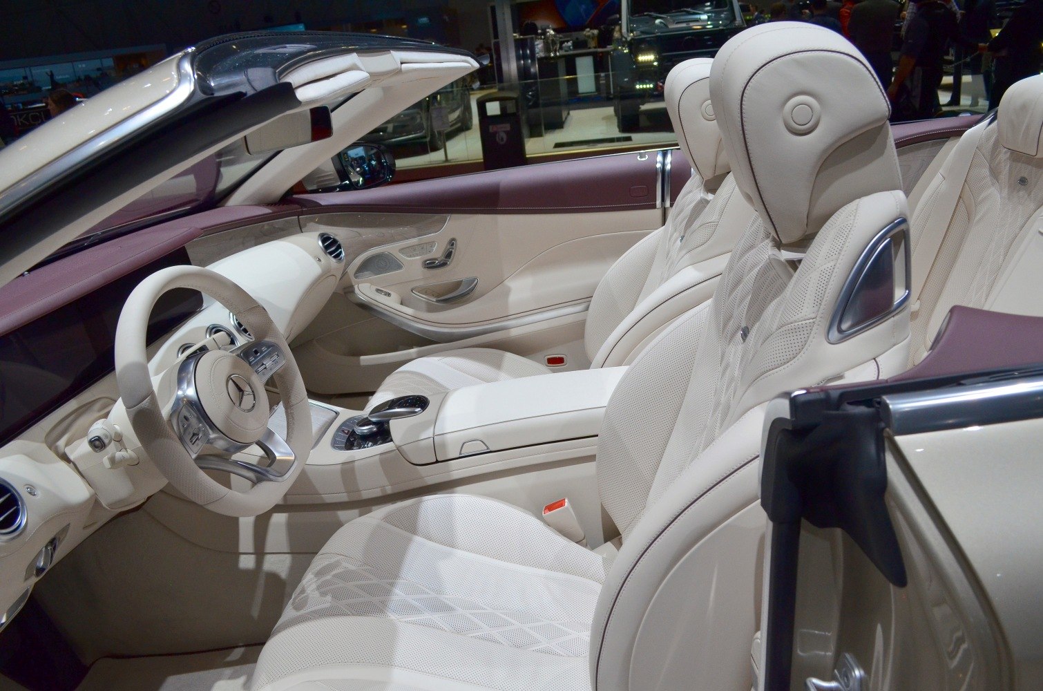 Luxurious beige leather seats with diamond stitching and plush dashboard