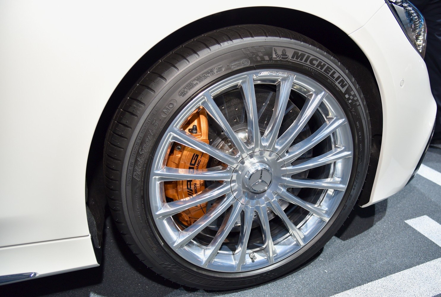 AMG multi-spoke alloy wheel and orange AMG brake calipers