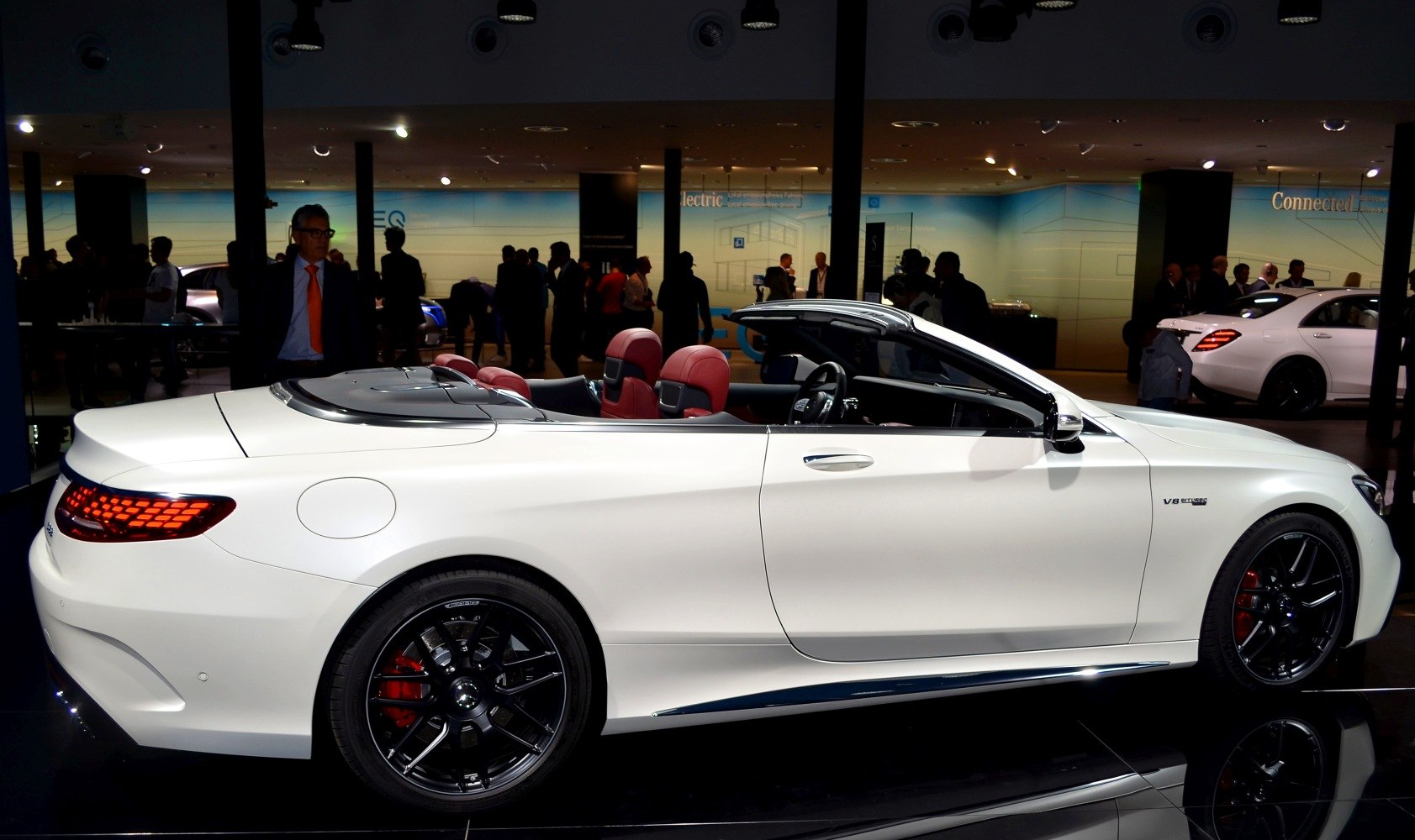 Convertible with sporty black wheels and red leather interior