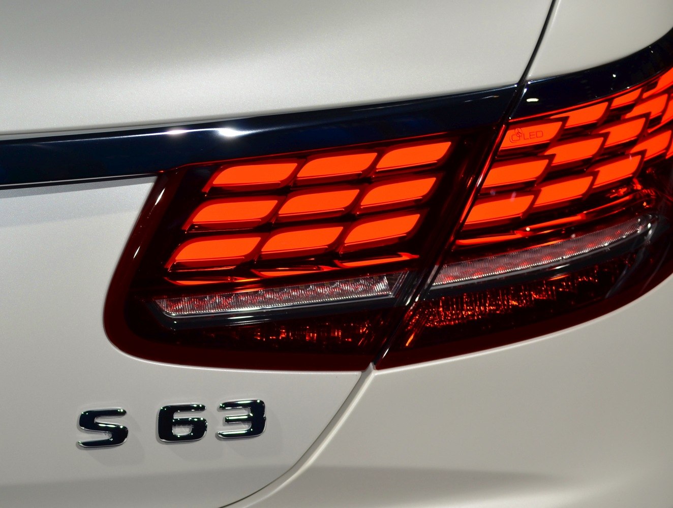 Rear LED tail light with S63 badge on luxury convertible
