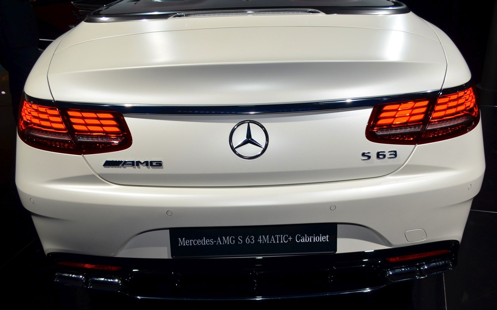 Distinctive LED taillights and AMG badging on a luxury convertible rear.
