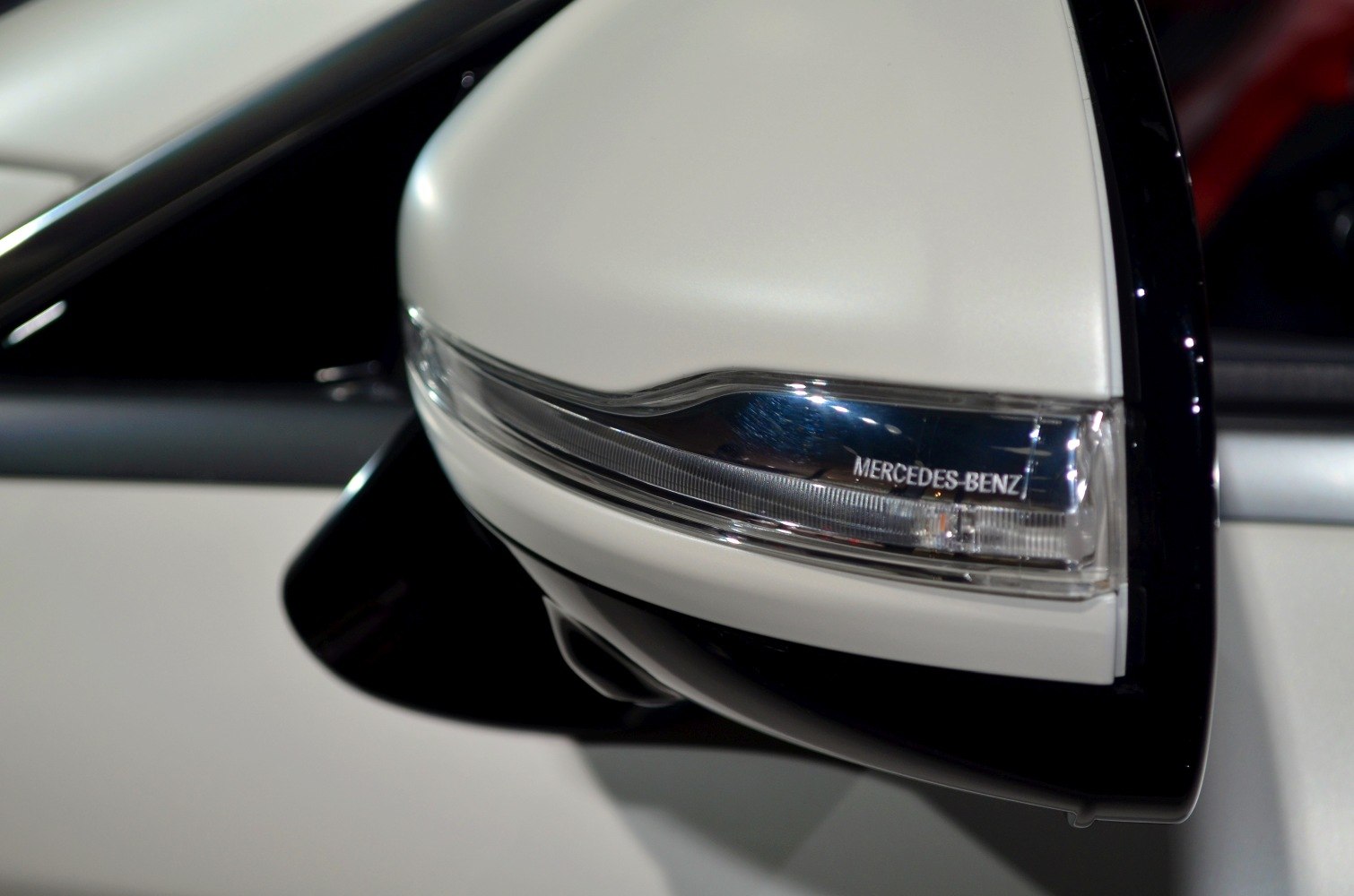 Close-up of side mirror with integrated indicator light