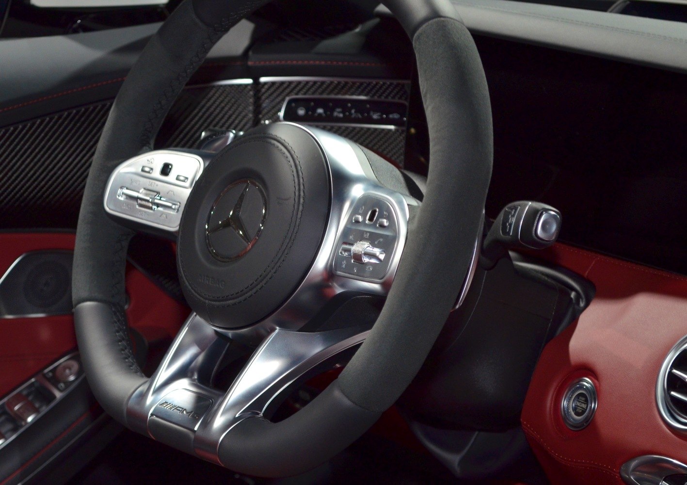 Luxury AMG steering wheel with multifunction controls and carbon fiber trim