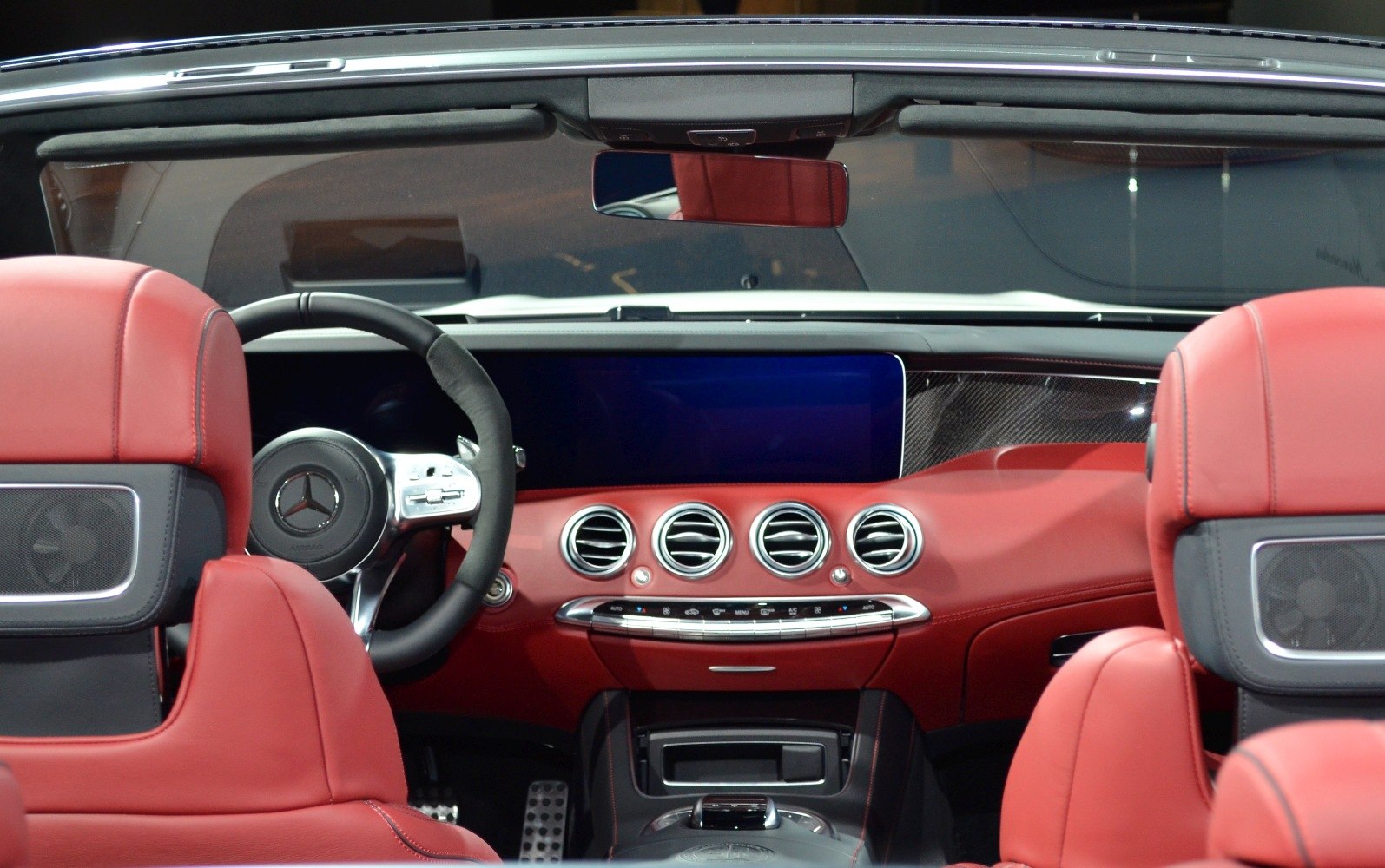 Red leather interior with modern dashboard and steering wheel