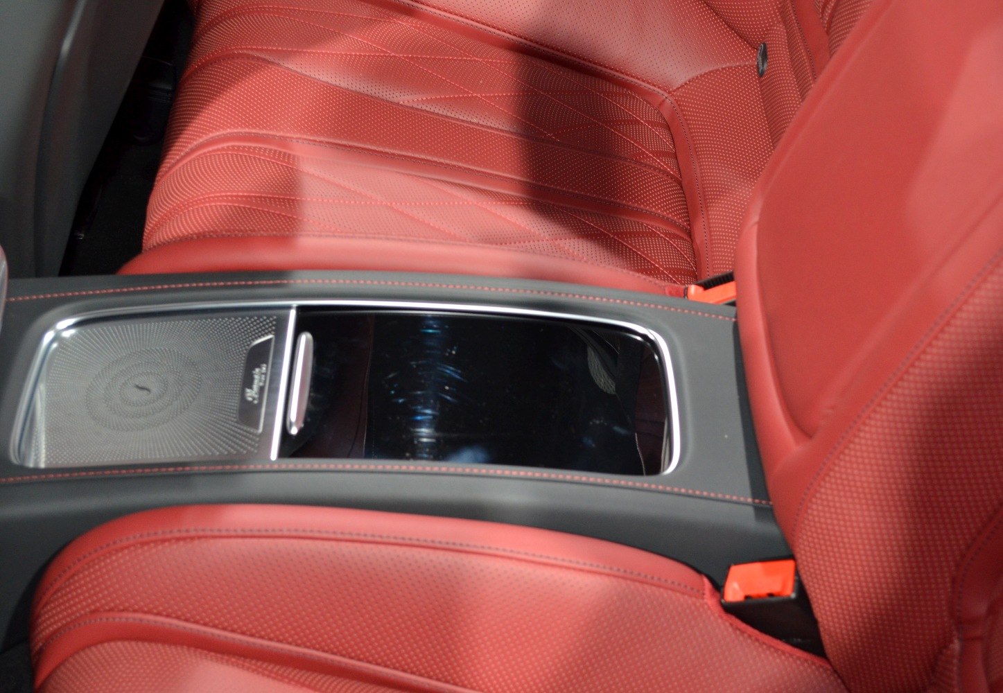 Red perforated leather seats with center console detail