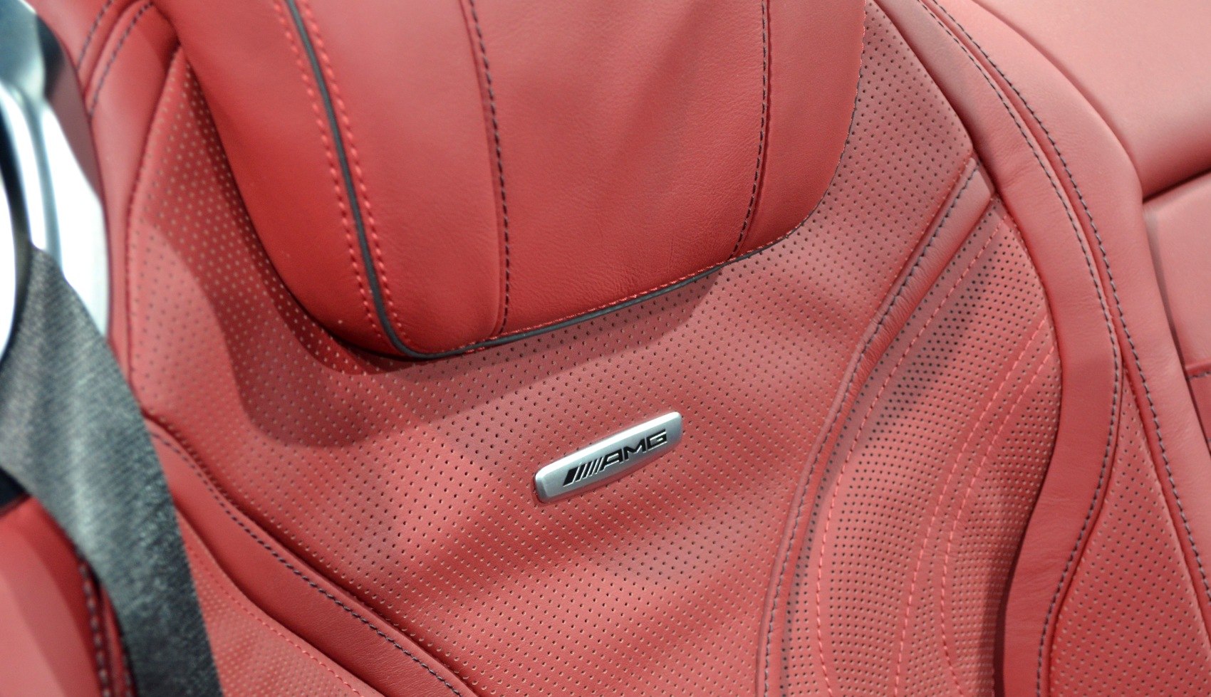 Red perforated AMG leather car seat with detailed stitching