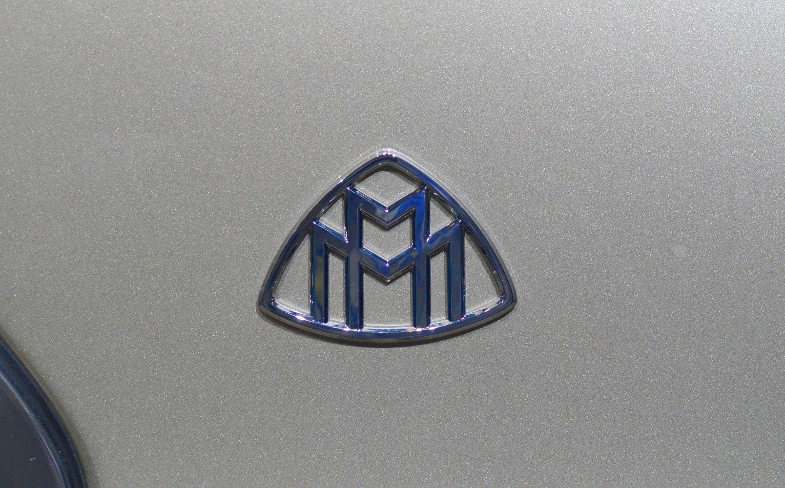 Close-up of Maybach emblem badge on car surface