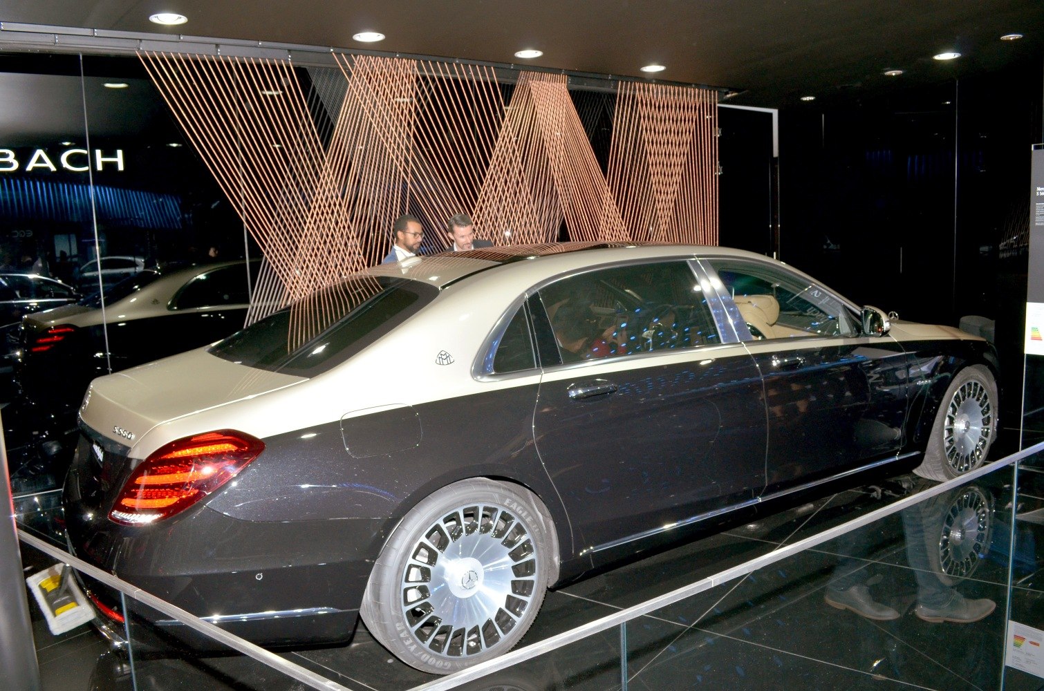 Two-tone paint luxury sedan with exclusive large wheel design.