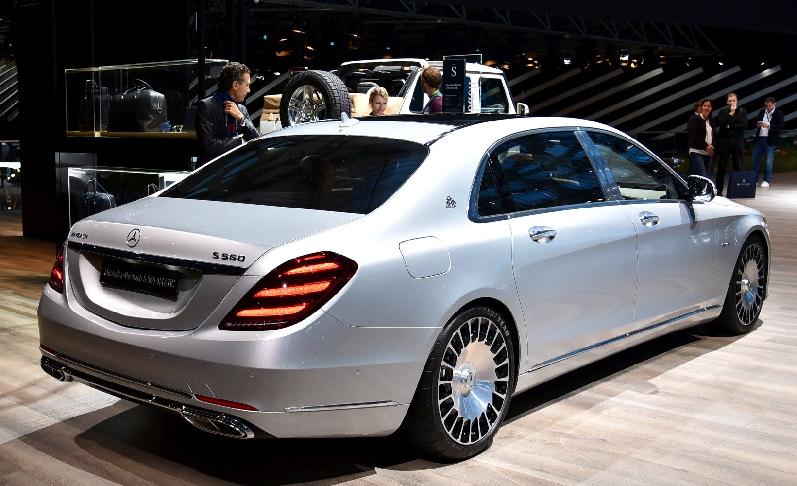 Silver luxury sedan with rear LED lights and distinctive alloy wheels