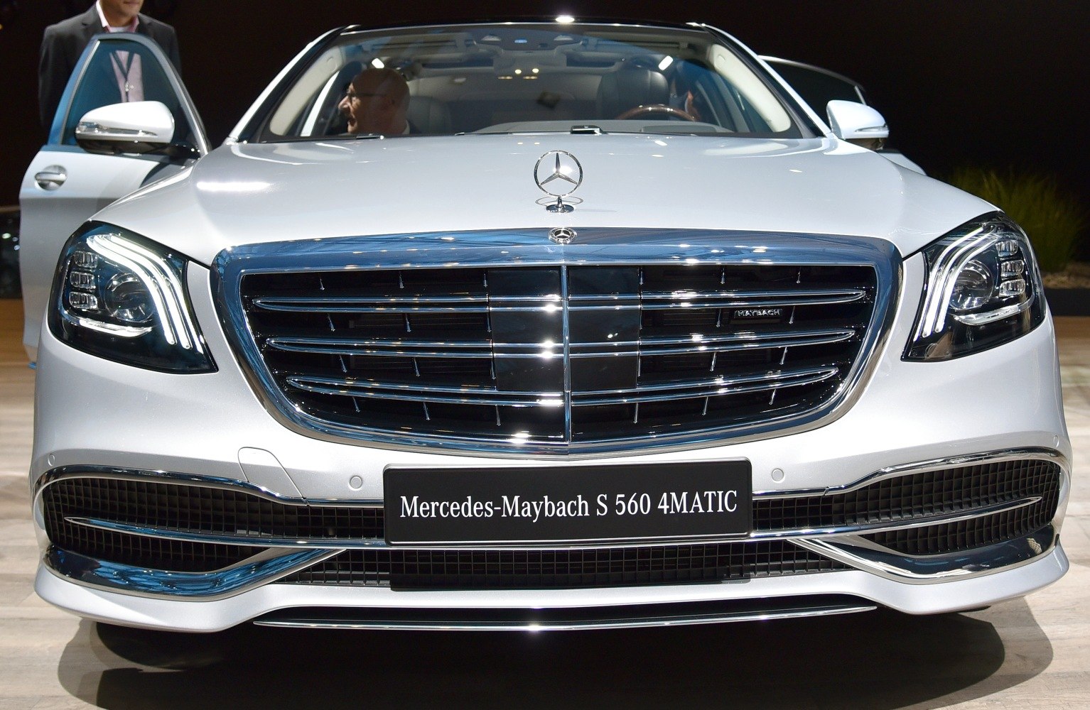 Front chrome grille and LED headlights of a luxury sedan