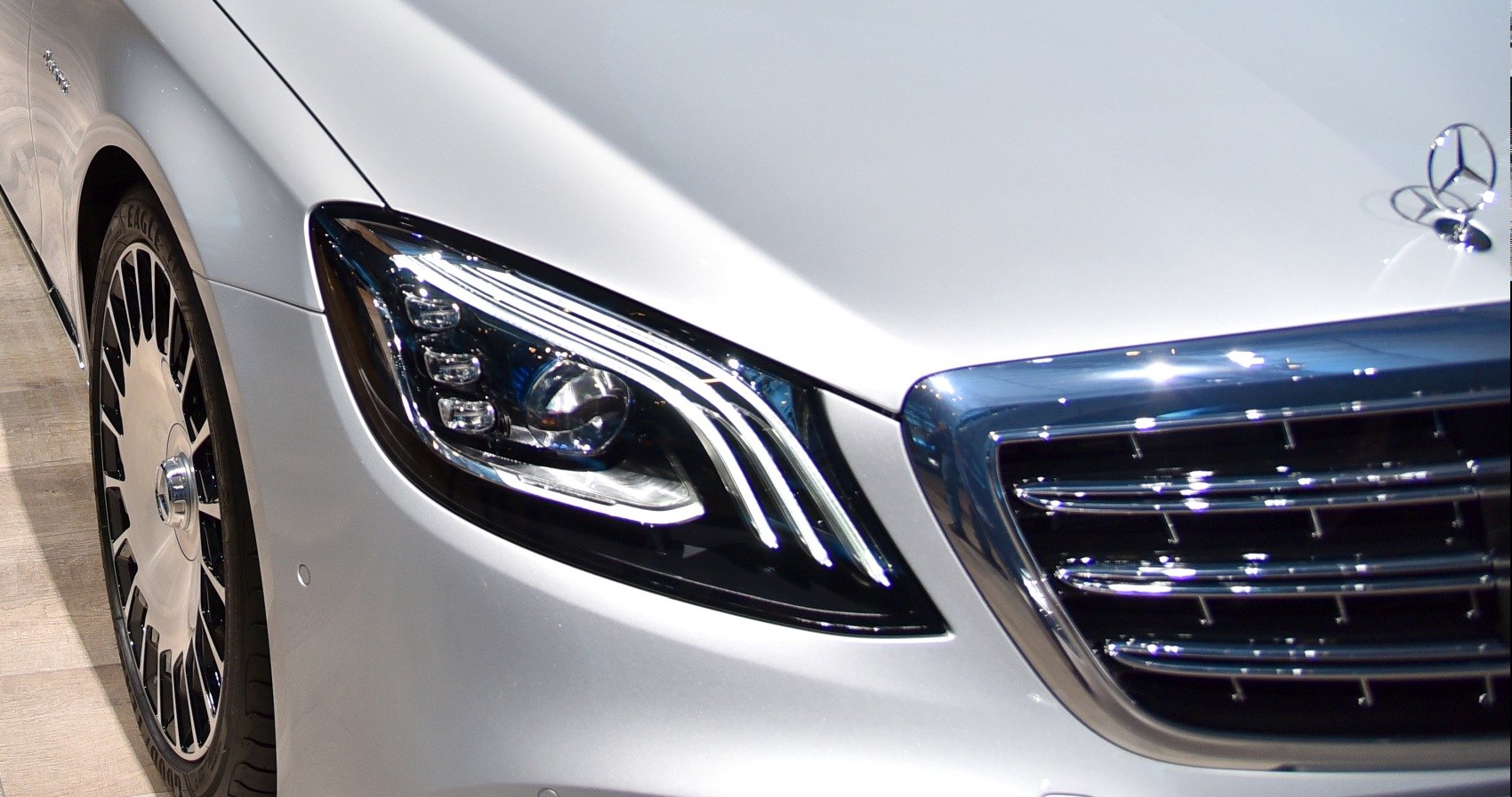 Close-up of luxury LED headlight and chrome grille design