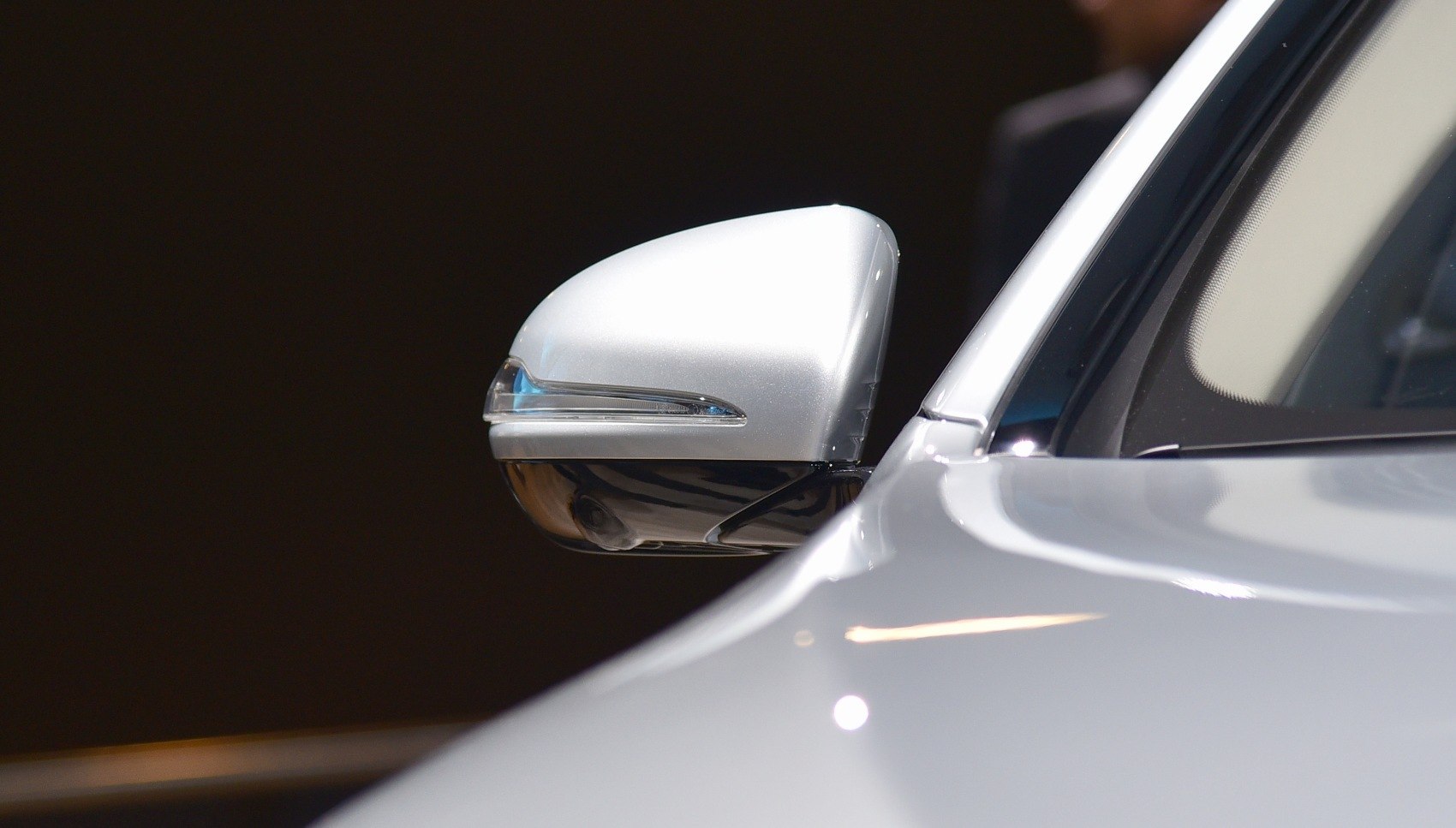Side mirror with integrated LED turn signal and under-camera