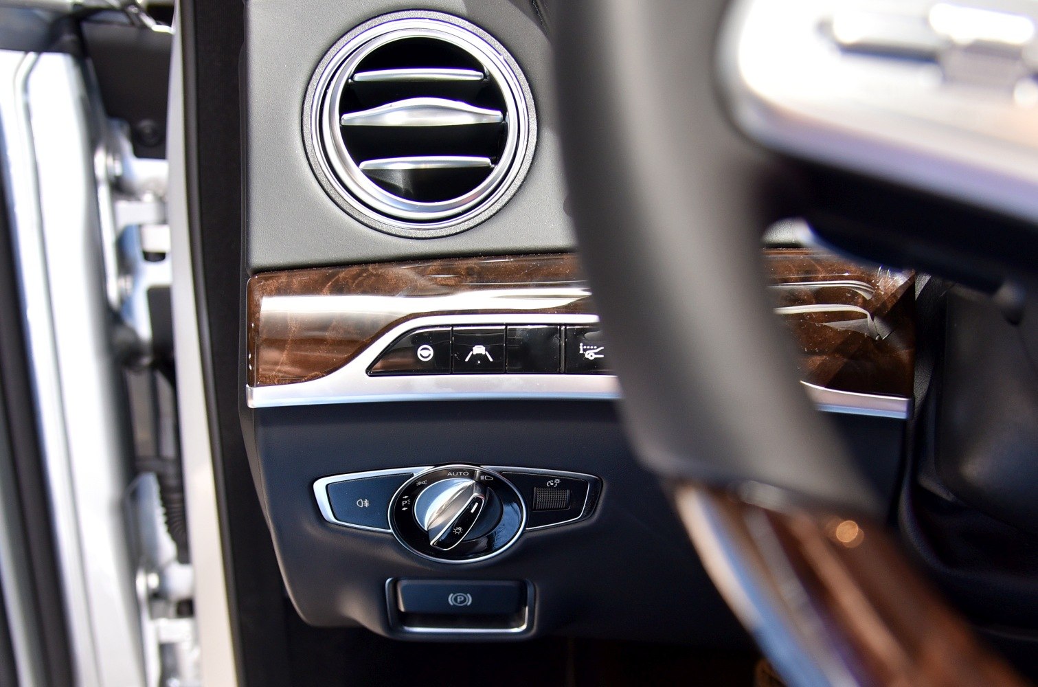 Luxury interior control panel with air vent and light switch dial