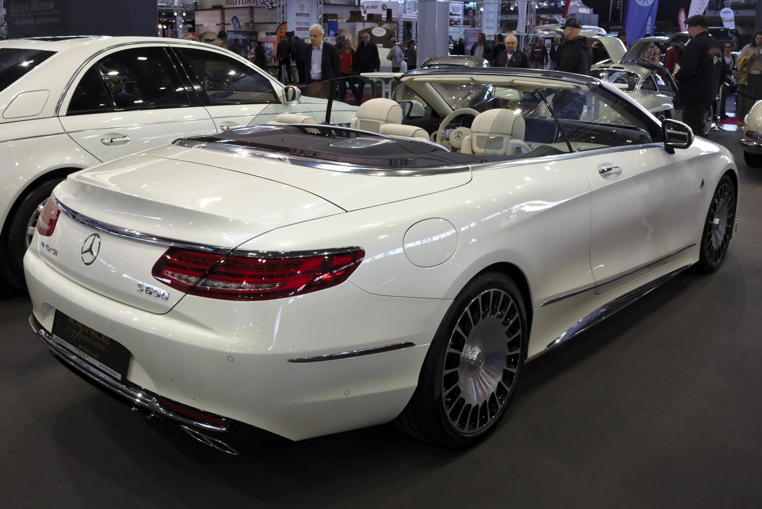 Rear and side view of luxury convertible with elaborate alloy wheels and distinctive rear lights.