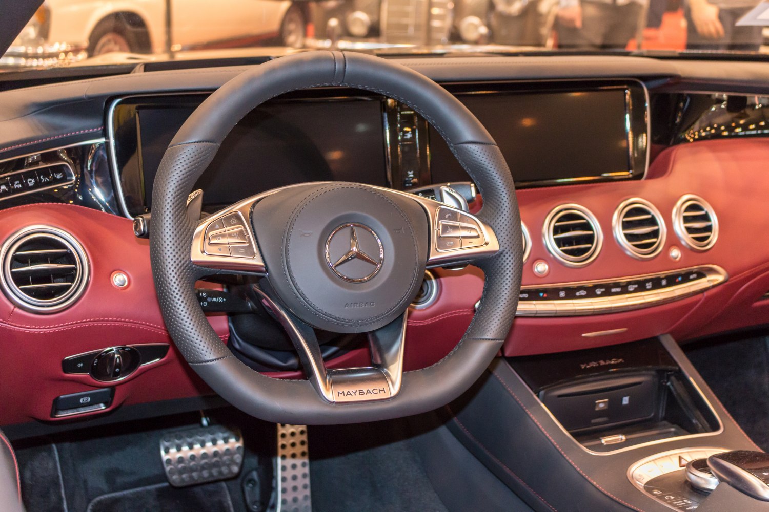 Luxury steering wheel with Maybach branding and sophisticated dashboard controls