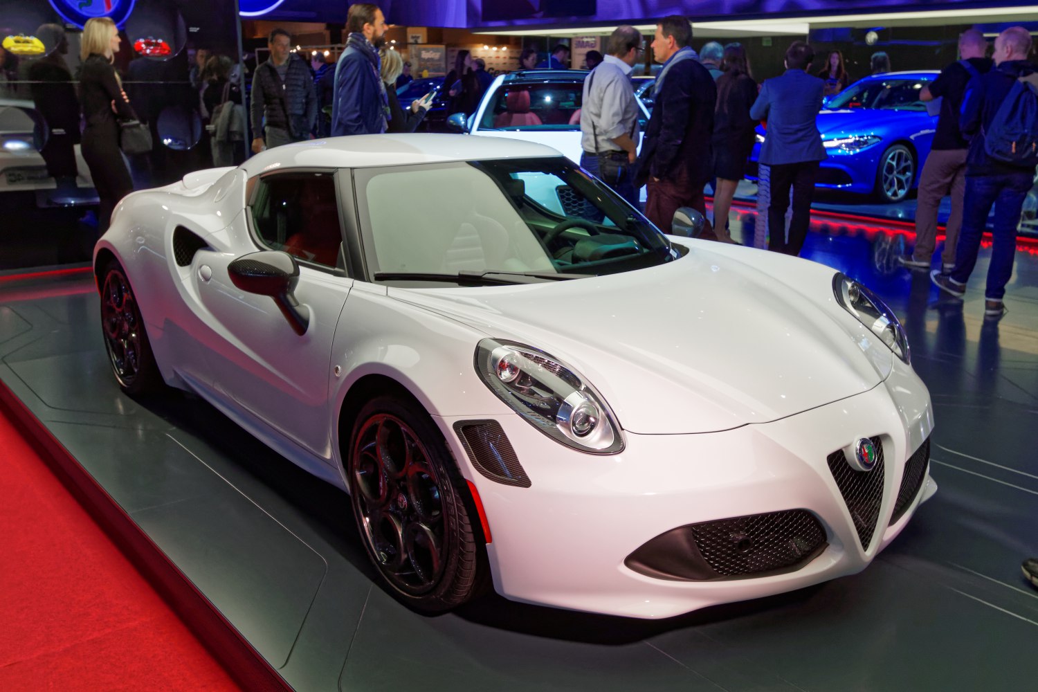 White sports coupe with unique headlights and side air intakes