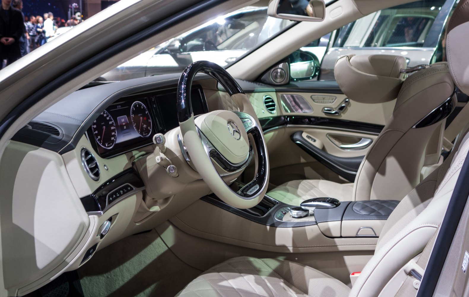 Luxury steering wheel and plush quilted leather seats in spacious vehicle interior