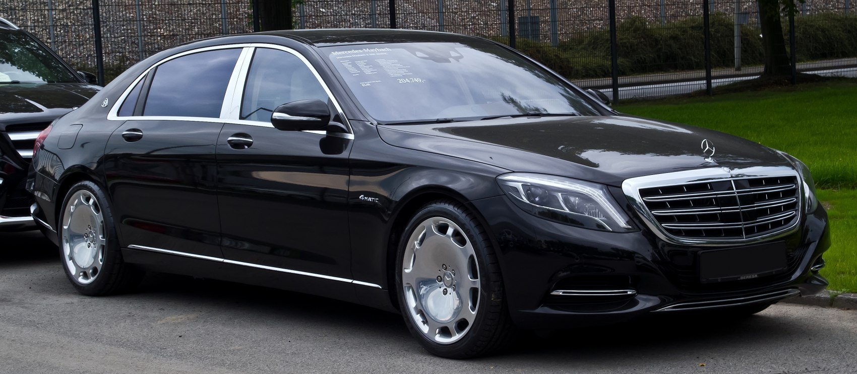 Luxury sedan with chrome grille and polished alloy wheels