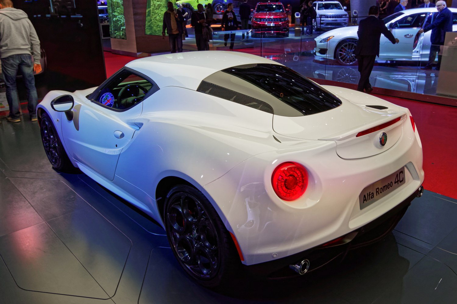 Rear and side view of compact sports coupe with round taillights