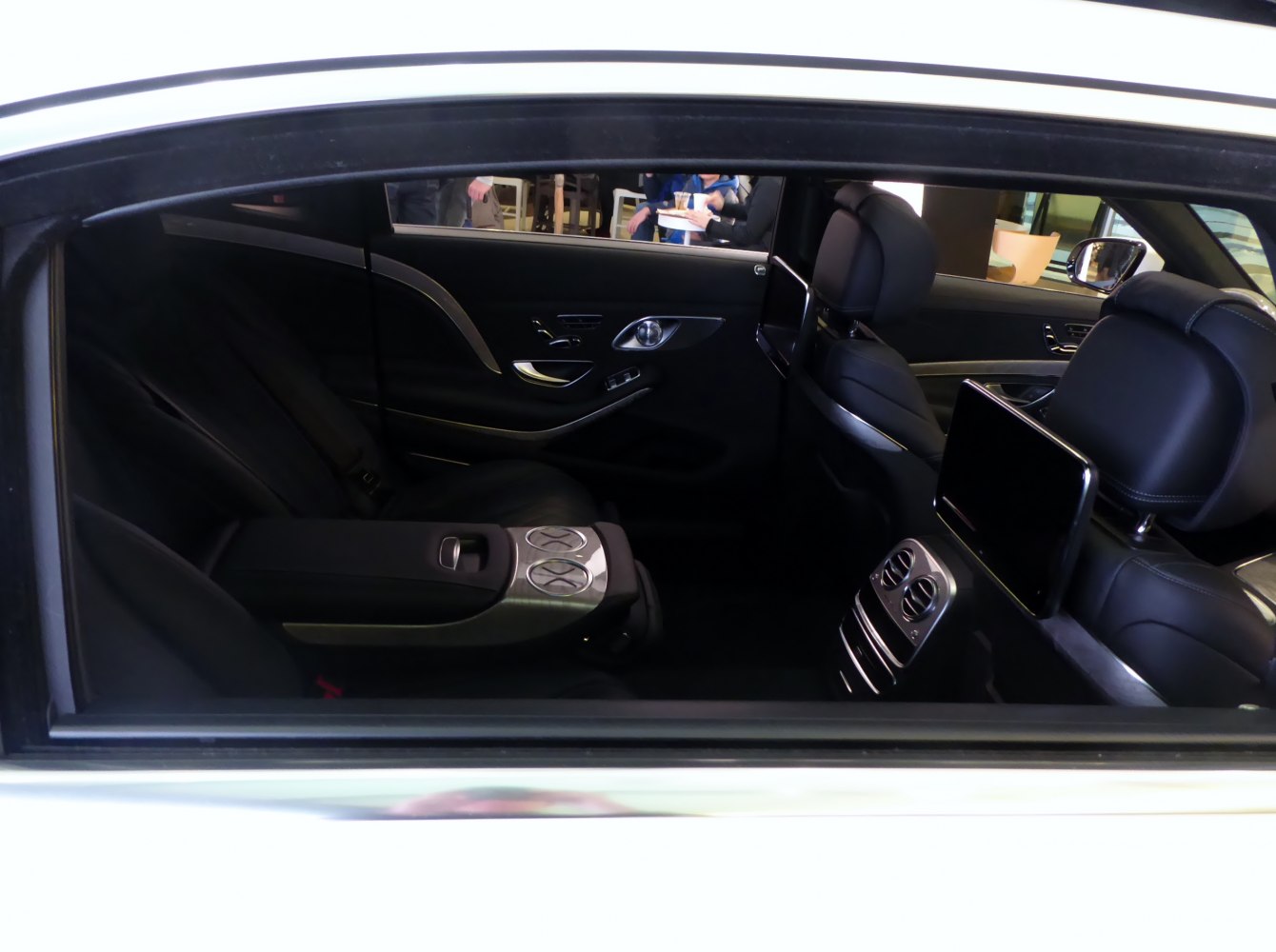 Luxury rear interior with dual screens and advanced climate controls